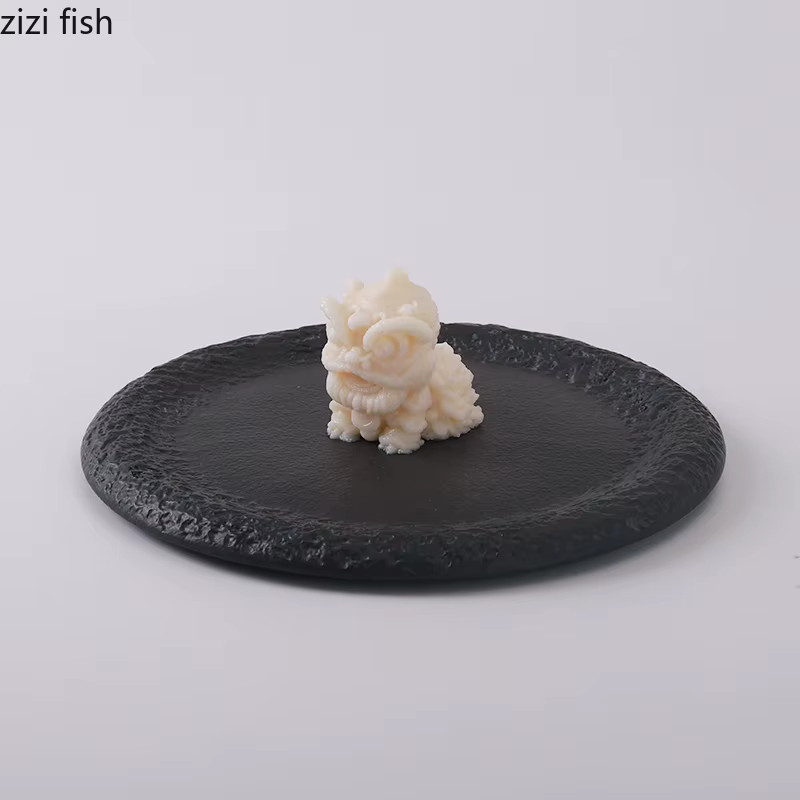 Assiette ronde en céramique noire