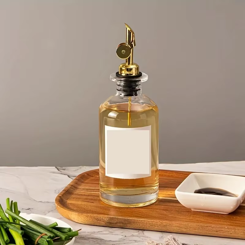 Bouteille distributrice d'huile d'olive en verre